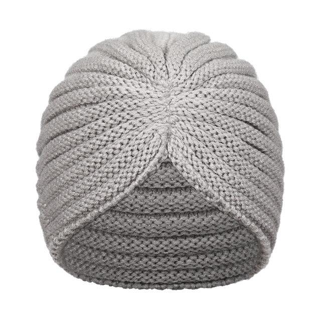Gray knitted turban-style beanie hat with ribbed and twisted design