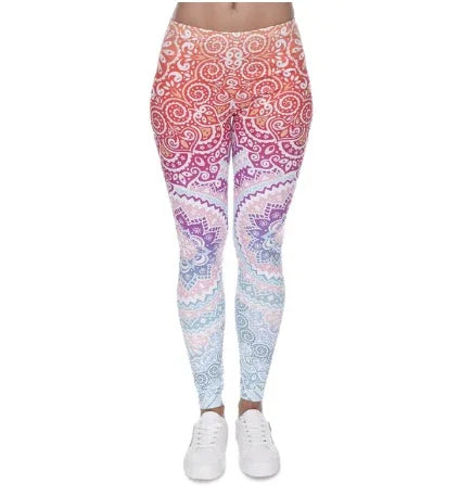 Woman wearing colorful mandala print leggings with gradient pink, purple, and blue hues and white sneakers