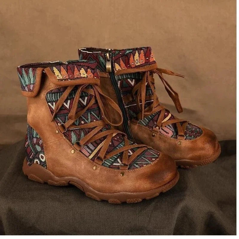 brown leather boots with colorful geometric fabric and lace-up design on dark background