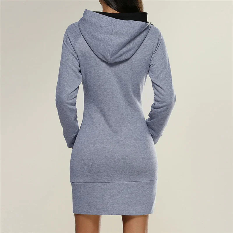 Back view of woman wearing fitted grey hooded sweatshirt dress with long sleeves