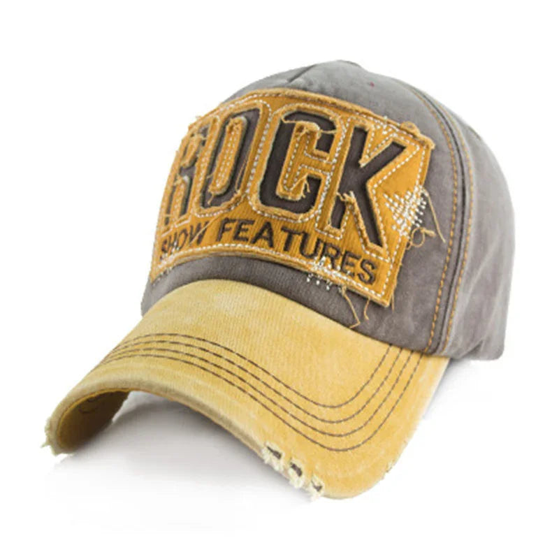 Vintage style baseball cap with yellow brim and gray crown, featuring distressed patch reading ROCK SHOW FEATURES