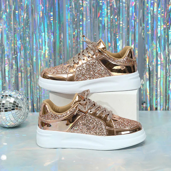 Rose gold glitter sneakers with white chunky soles and holographic backdrop with disco ball