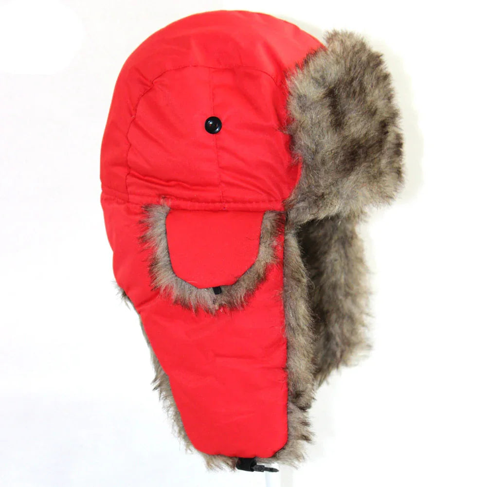 Red winter trapper hat with brown faux fur lining and ear flaps on white background