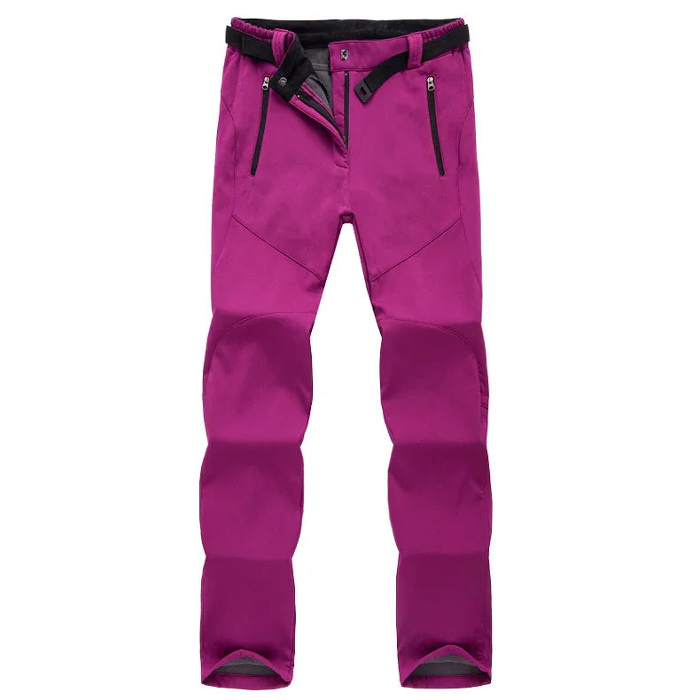 purple outdoor hiking pants with black adjustable belt and zippered pockets on white background