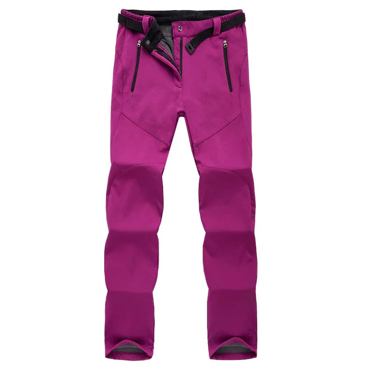 purple outdoor hiking pants with black adjustable belt and zippered pockets on white background