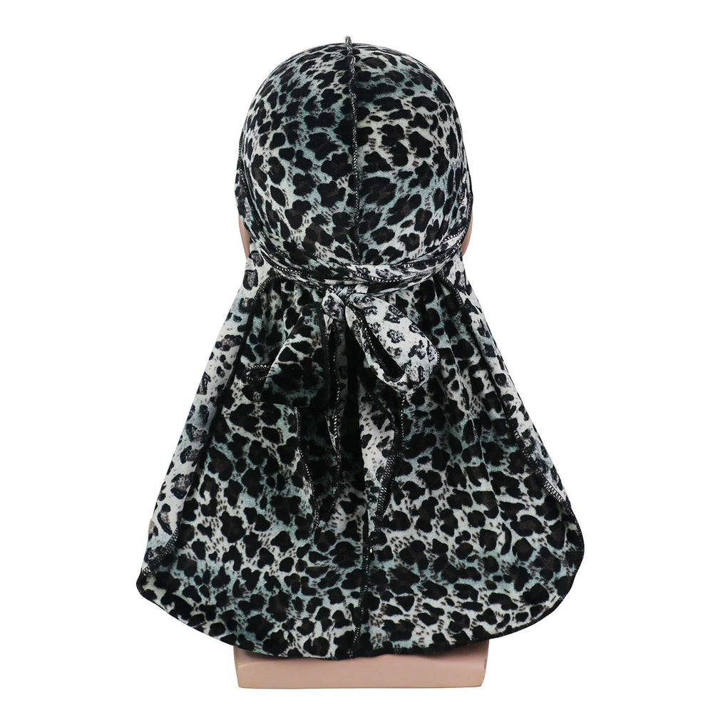 Black and grey leopard print durag with flap and tied knot shown from the back on a mannequin