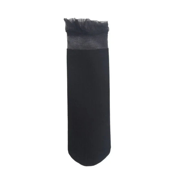 Single black sock with sheer ruffled top and ribbed cuff detail on white background