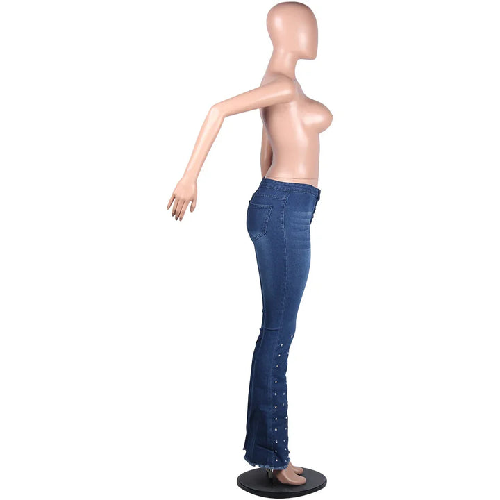 Side view of female mannequin wearing blue high-waisted jeans with button details on flared legs