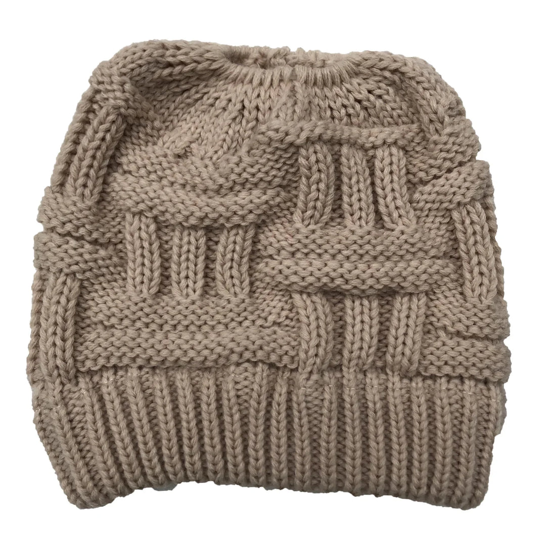 Beige knitted beanie hat with a textured basket weave pattern and ribbed brim