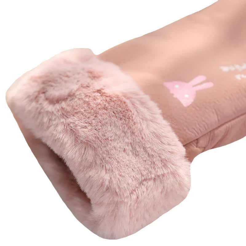 Close-up of a pink plush winter glove with soft faux fur cuff and bunny design