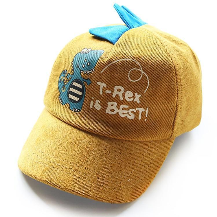 Yellow children's cap with blue dinosaur spikes and T-Rex graphic saying 'T-Rex is BEST!'