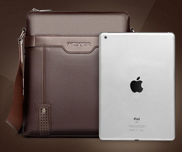Brown leather WEIXIER shoulder bag next to silver Apple iPad tablet on brown background