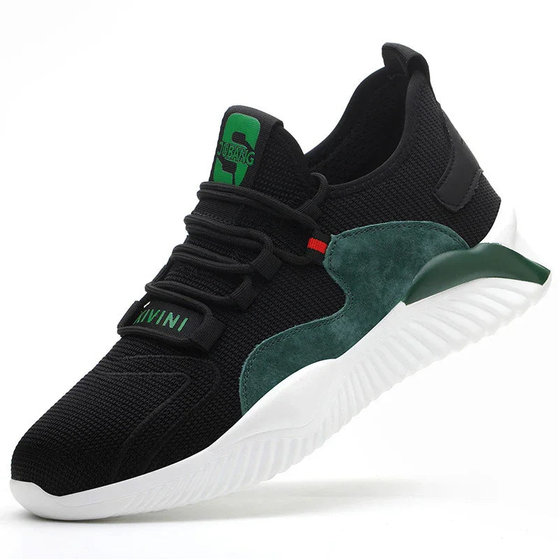 Black athletic sneaker with green suede accents, white sole, and green logo on tongue