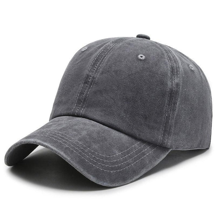 Dark gray washed cotton baseball cap with curved brim and stitched panels