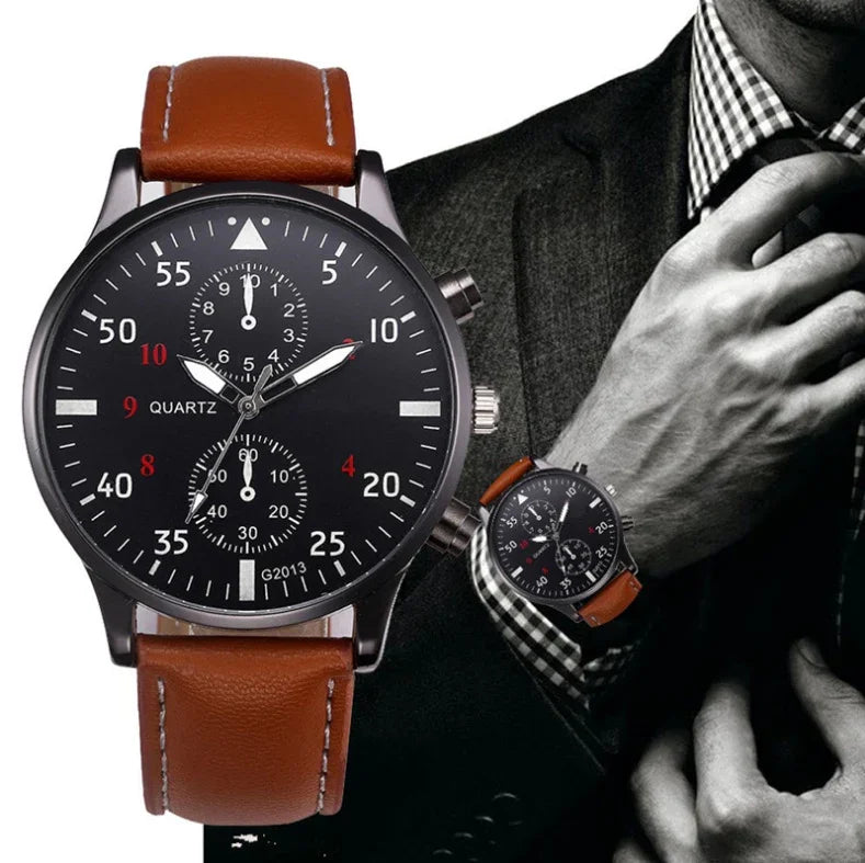 Mens wristwatch with black dial, brown leather strap, chronograph subdials, worn with suit and tie