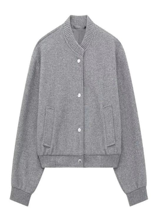 Grey wool varsity-style jacket with ribbed collar, cuffs, button front, and side pockets