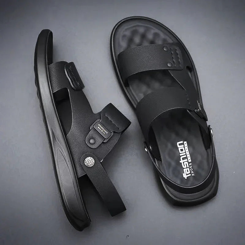 Black men's fashion sandals with adjustable straps and textured footbed on gray background