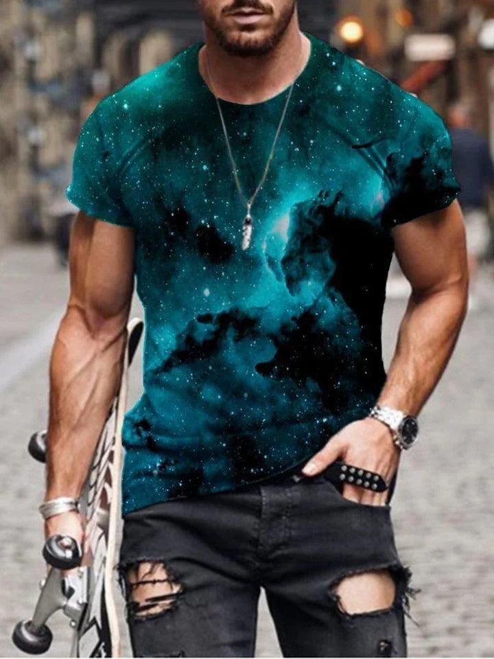 Muscular man wearing a galaxy print t-shirt and ripped black jeans holding a skateboard on city street