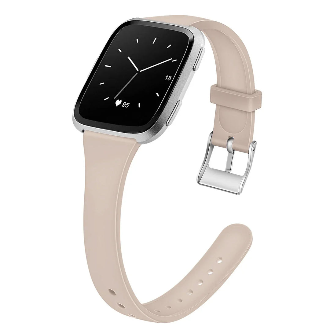 Beige silicone strap smartwatch with silver case and heart rate display on black screen