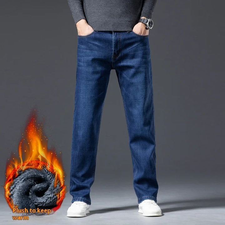 Men's blue denim jeans styled with white sneakers and gray sweater, featuring plush warm lining