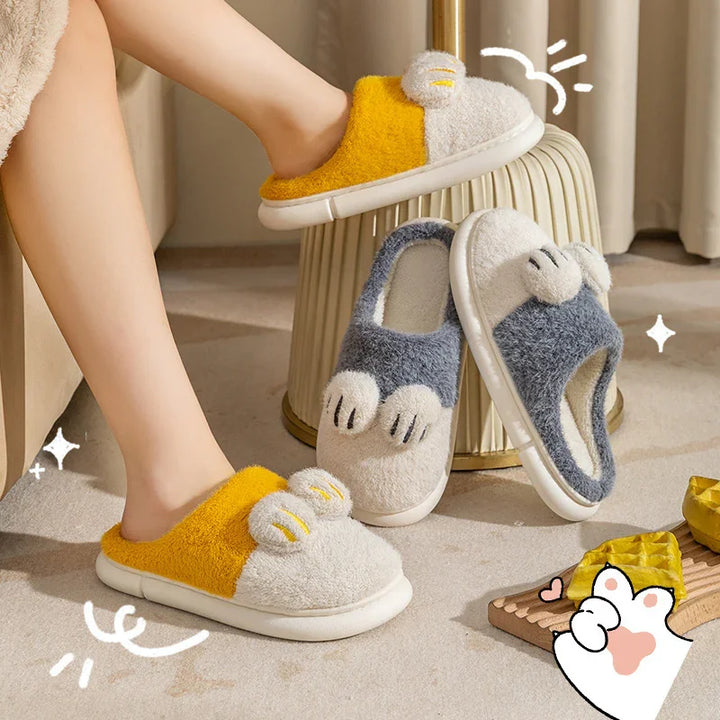 Cozy fuzzy slippers with paw design in yellow and gray on carpet, featuring soft plush indoor footwear