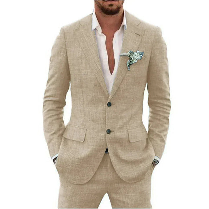 Man wearing beige linen suit with white dress shirt and blue floral pocket square
