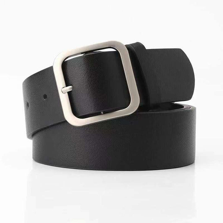 Black leather belt with square silver buckle rolled on white background