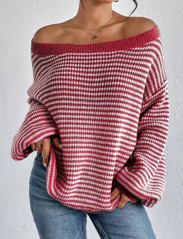 Woman wearing off-shoulder red and white striped knit sweater paired with blue jeans