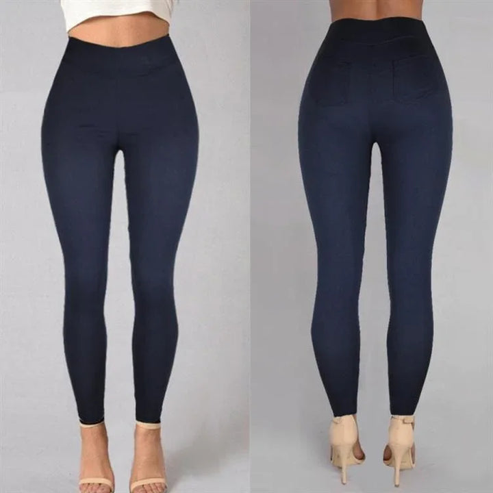 Front and back view of woman wearing high-waisted navy blue leggings with pockets, paired with beige high heels