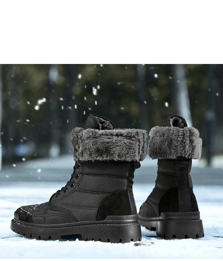 Black winter boots with gray fur lining on snowy ground with falling snowflakes