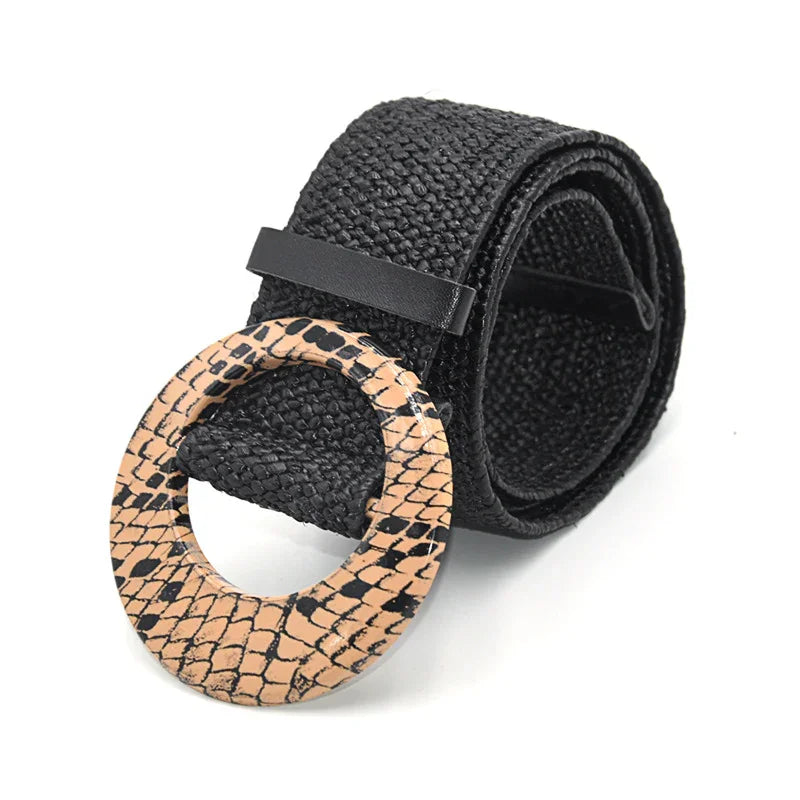 Black woven fabric belt with round beige snakeskin-patterned buckle