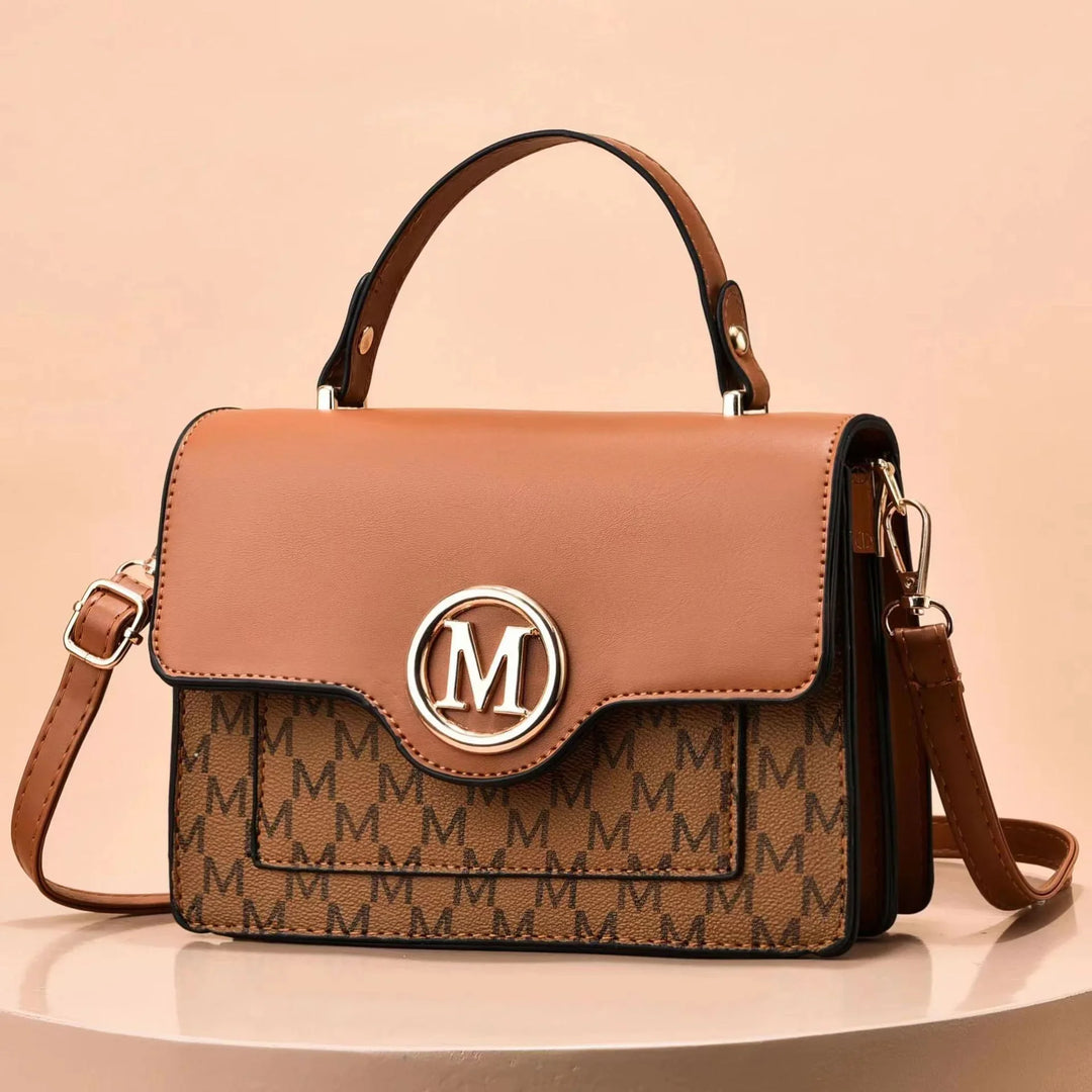 Brown leather and canvas handbag with M monogram pattern and gold circular M logo