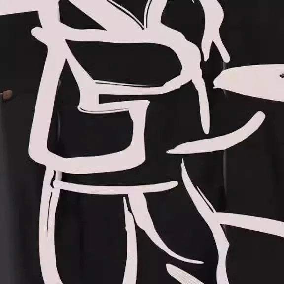 Abstract white line art of a person seated at a table on black background