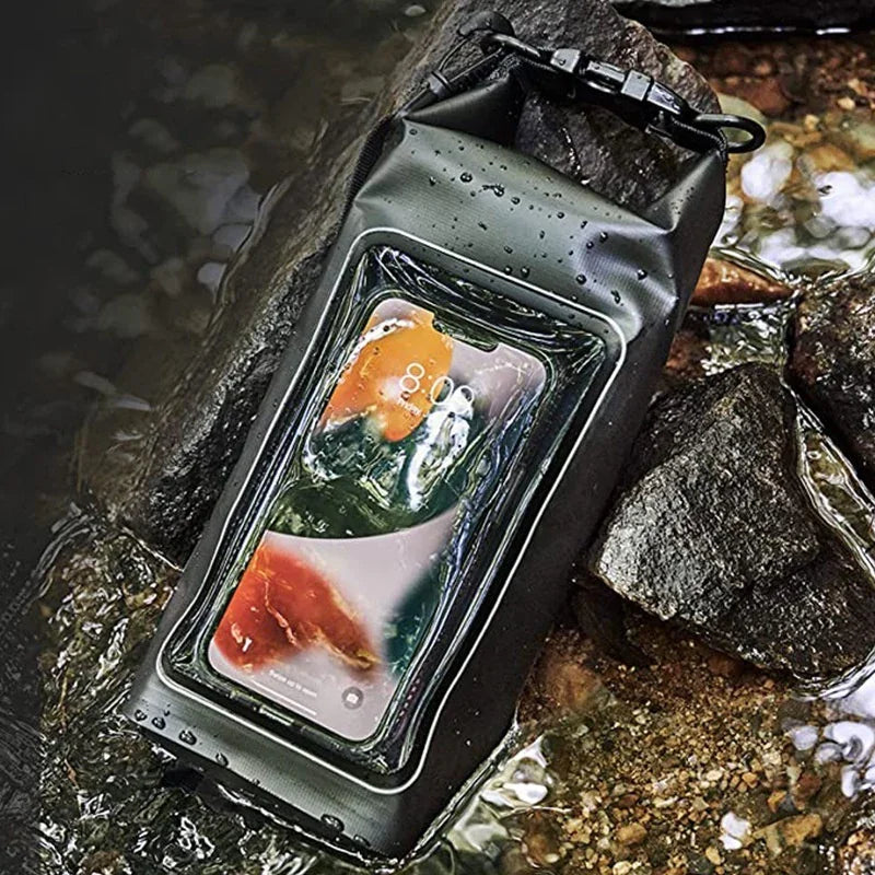 Smartphone in waterproof pouch floating in stream on rocks, protective phone case outdoors