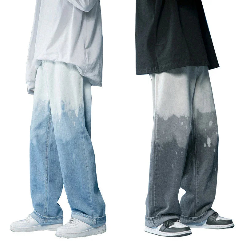 Two models wearing baggy tie-dye gradient jeans in blue and gray, paired with casual sneakers