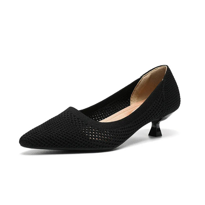 Black pointed-toe kitten heel shoe with woven texture and beige inner lining on white background