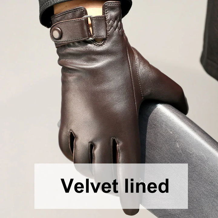 Close-up of brown leather velvet-lined gloves with adjustable strap on wrist