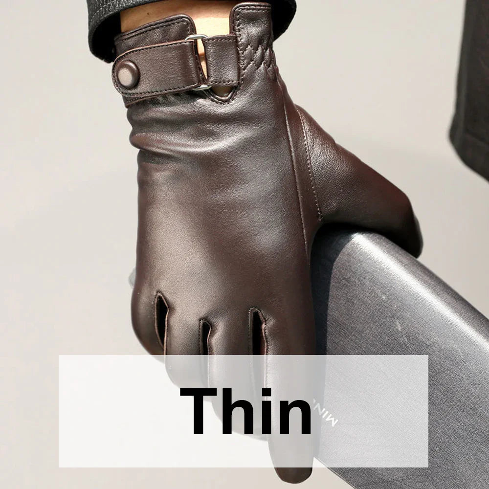 Close-up of a hand wearing thin brown leather gloves holding a dark gray hard case