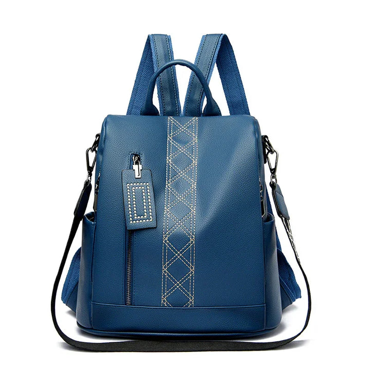 Blue leather backpack with front zipper pocket, decorative stitching, and adjustable straps
