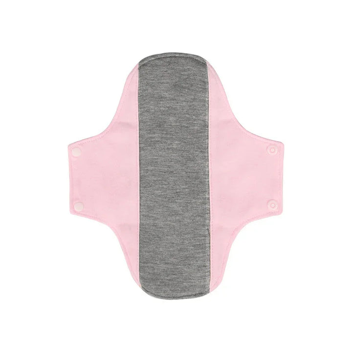 Reusable cloth menstrual pad with light pink wings and dark gray absorbent center, snap buttons