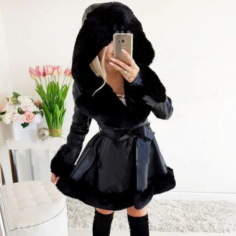 Woman wearing black faux fur trim hooded leather coat and thigh-high boots taking mirror selfie