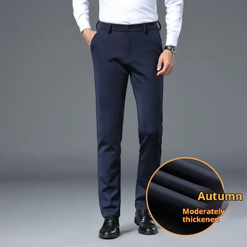 Man wearing navy blue autumn-wear trousers, moderately thick fabric, paired with white shirt and black shoes