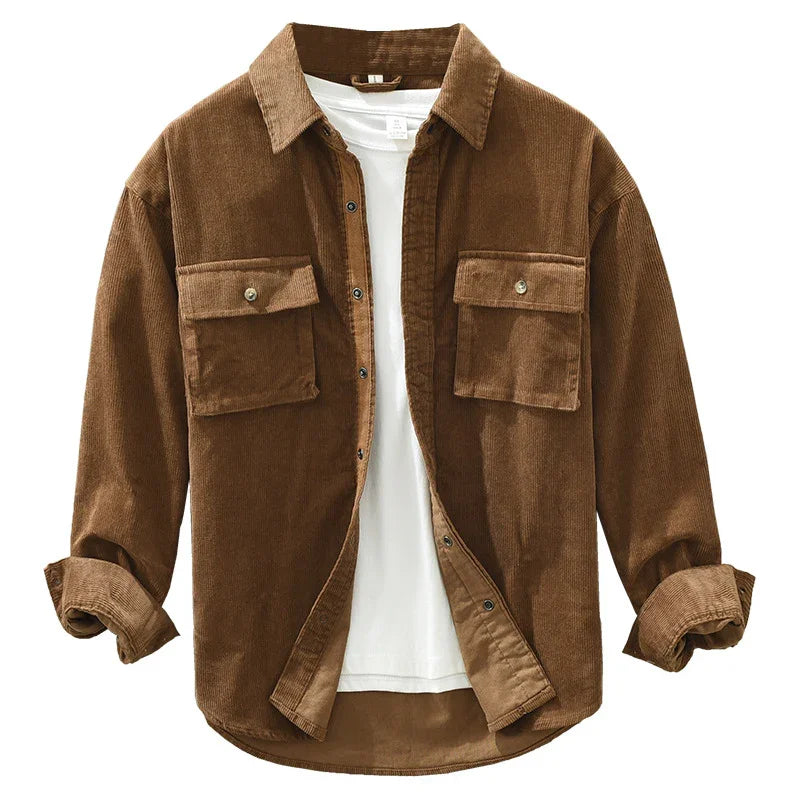 Brown corduroy shirt jacket with buttoned chest pockets over a white T-shirt