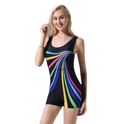 Woman modeling black one-piece swimsuit with colorful stripes, studio background
