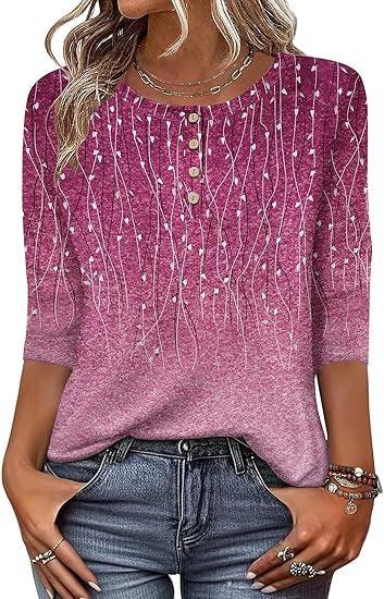 Woman wearing a pink patterned knit blouse with button detail and three-quarter sleeves paired with blue jeans