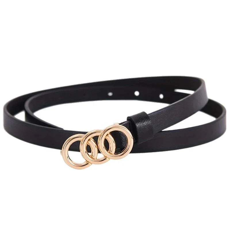 Black leather slim belt with three interconnected gold rings buckle on white background