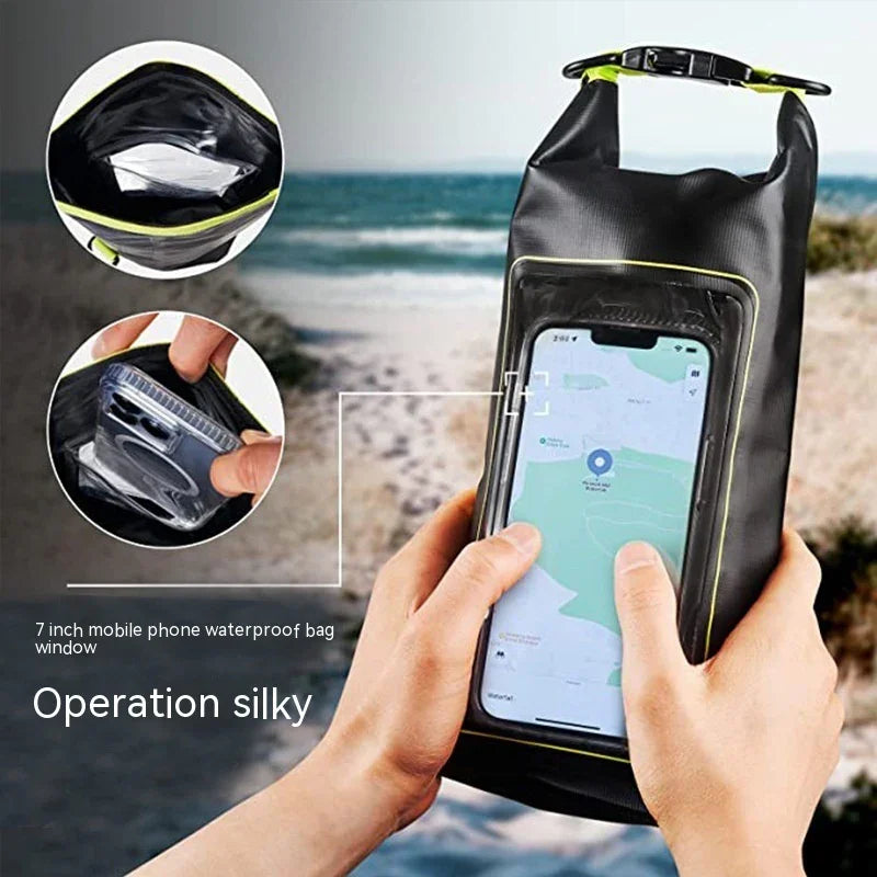 Hands using phone inside black 7 inch waterproof bag with clear window on seaside background