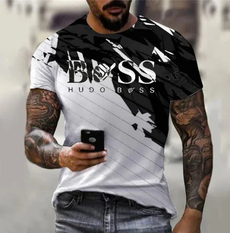 man wearing black and white Hugo Boss t-shirt with abstract design and tattoos holding phone