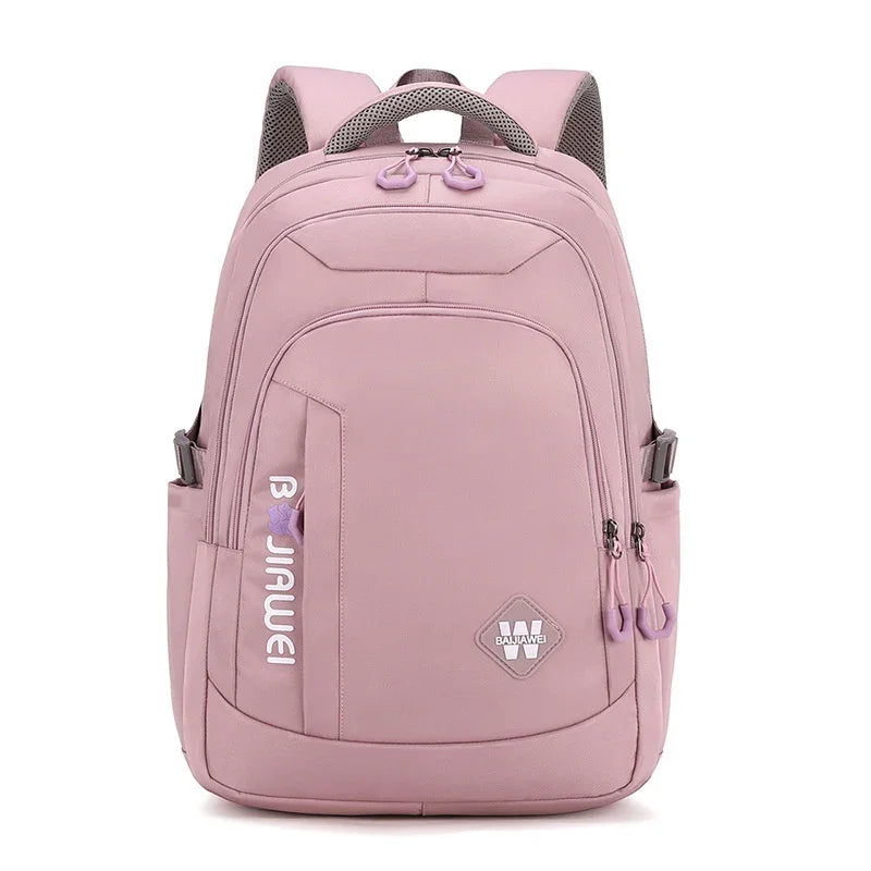 Pink backpack with multiple compartments, brand logo, and adjustable padded shoulder straps