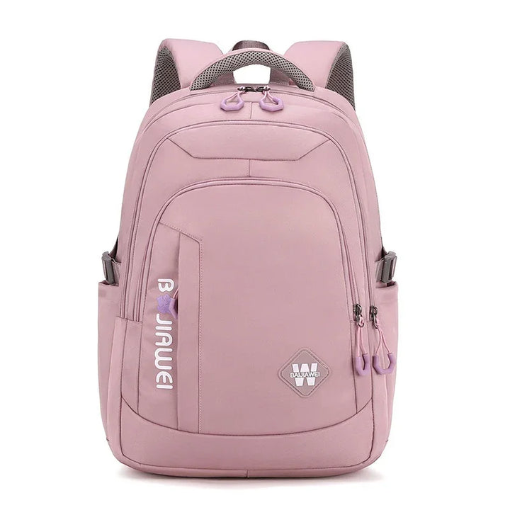 Pink backpack with multiple compartments, brand logo, and adjustable padded shoulder straps